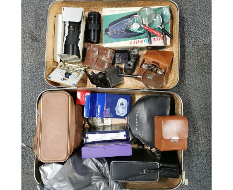 A vintage case of cameras, lenses, etc.