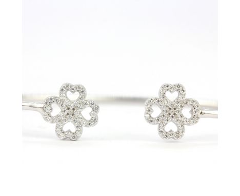 An adjustable 925 silver clover bangle set with white stones, internal L. 6cm.