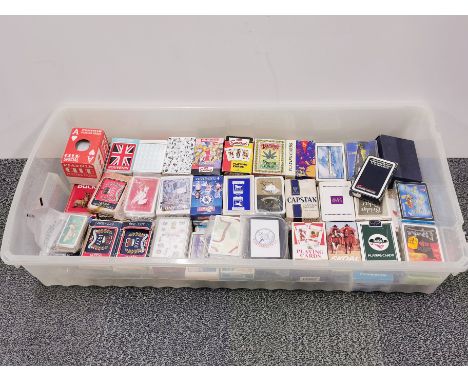 A large collection of vintage packs of playing cards.
