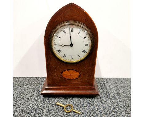 An Edwardian inlaid mahogany mantle clock, H. 23cm. Understood to be in working order.
