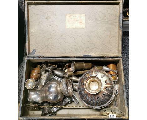 A vintage case of mixed metalware.