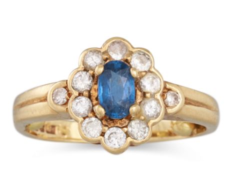 A VINTAGE SAPPHIRE AND DIAMOND CLUSTER RING, mounted in 9ct gold. Size: C