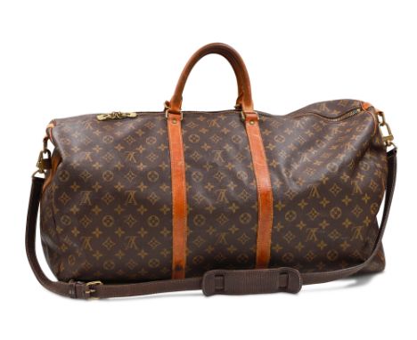 A VINTAGE LOUIS VUITTON KEEP ALL CANVAS BAG, with top handle and shoulder strap