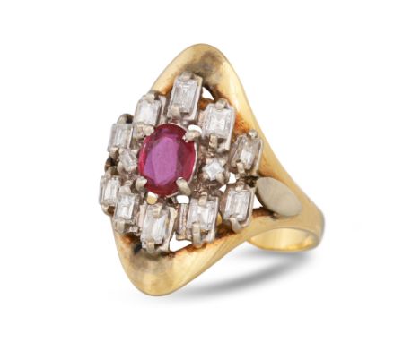 A MID - CENTURY DIAMOND AND RUBY DRESS RING, the oval ruby to a baguette diamond surround, mounted in 18ct gold, size J, 5.2 
