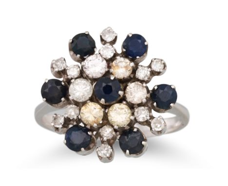 A VINTAGE DIAMOND AND SAPPHIRE CLUSTER RING, mounted in white gold, size O - P, 6.7 g.