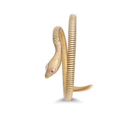 AN ANTIQUE 9CT GOLD SNAKE BANGLE, of spring coiled form, ruby eyes