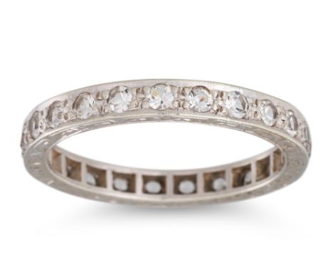 A VINTAGE DIAMOND ETERNITY RING, the circular diamonds mounted in 9ct gold, with engraved mount. Estimated: weight of diamond
