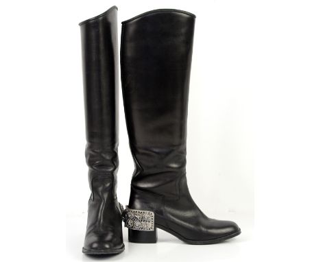 Chanel black leather riding style boots from Autumn 2007 Paris Monte Carlo collection with white metal spur type cuffs to hee