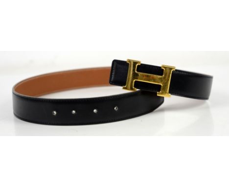 Hermes Constance belt with yellow metal “H” buckle and Black and Tan reversible belt , stamped A 29 70.         Scratches to 