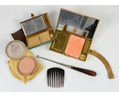 A Minaudiere Compact in gilt metal, with comb lipstick holder, mirror and cigarette case, marked Evans and chain strap, Strat