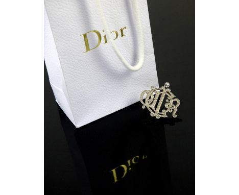 Two Christian Dior costume jewellery brooches, one in gilt metal, the other in diamanté, both marked Christian Dior on back w