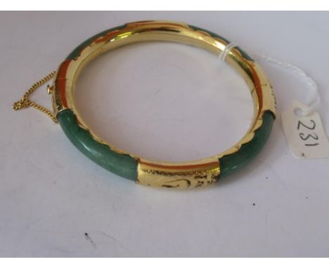 An unusual gilt and Jadite bangle      