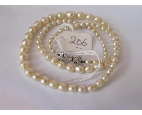 Vintage graduated pearl necklace set with a white gold  diamond bow clasp        