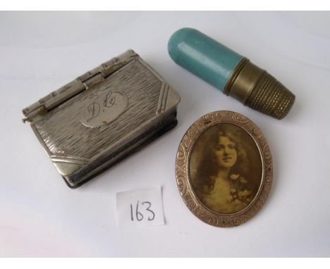 Vesta case, bobbin holder and a brooch     