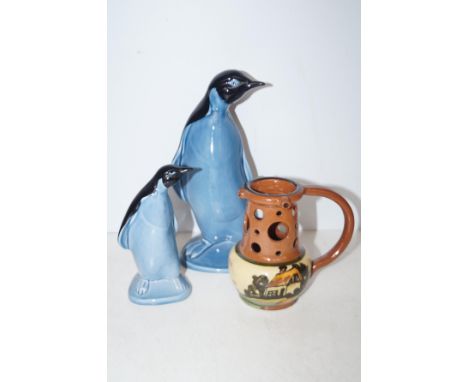 2 Poole Penguins together Motto Puzzle Jug. Largest 23cm
