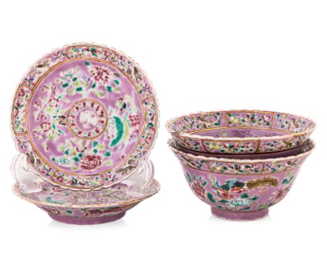 A PAIR OF 'IN AND OUT' FAMILLE ROSE TEA BOWLS AND SAUCERS Each of pink ground decorated in central crane medallion, flowers o