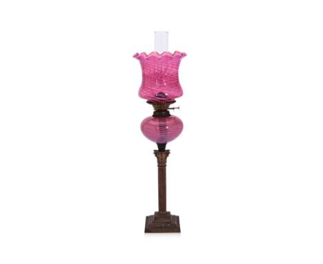 A LATE VICTORIAN DUPLEX TWIN-BURNER OIL LAMP
Brass fluted column base, cranberry glass bowl and shade with vaseline swirl, ha