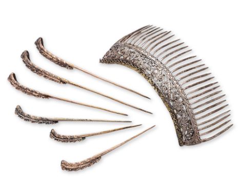 A SET OF SIX SILVER-GILT HAIR PINS AND A HAIR COMB
Six graduated hair pins with domed top and studded upper, triangular stamp