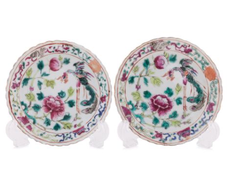 A PAIR OF FAMILLE ROSE TEA BOWLS AND SAUCERS
All four on white ground decorated with flying phoenix and peony, Buddhist emble