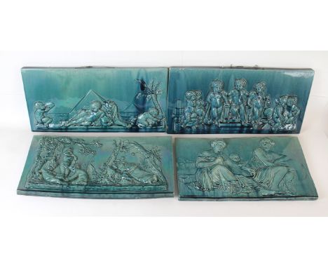 Four 19th Century ceramic wall plaquesEach decorated in relief various scenes to include cherubs beside lion, figures beside 