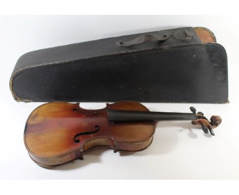 An early 20th Century mahogany violinWith two piece back, bears Stradivarius label to interior, length 60cm, together with a 