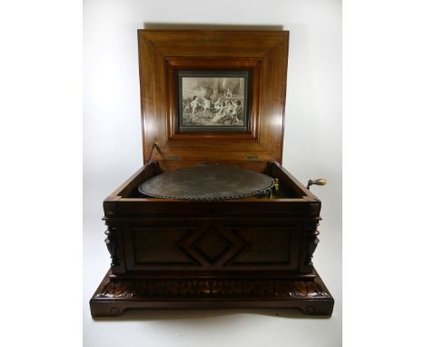 A Polyphon music box of large proportionsThe rectangular walnut and inlaid hinged case decorated with floral detail, the mech