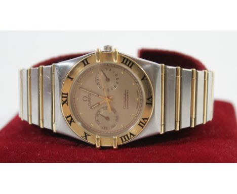 A Gents Omega Constellation Chronometer bi-metal wristwatchWith subsidiary day and date apertures, fitted in boxCONDITION REP