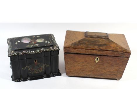 A Victorian lacquered papier mache tea caddyHaving ribbed body with mother of pearl inlay and gilt highlights, length 16cm, t