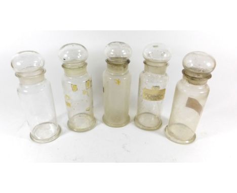 Five Victorian clear glass Pharmaceutical Chemist bottlesEach of cylindrical form with globe stoppers, height 23cm 