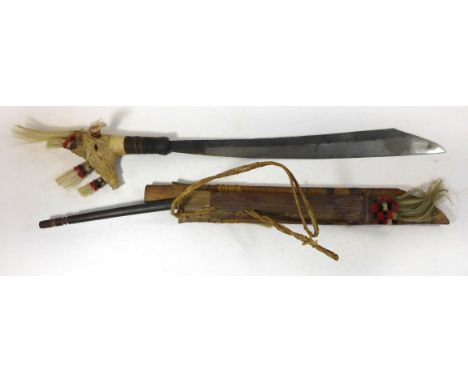 A Northern Borneo Parang Ihlang sword, 20th Century46cm hatchet blade, carved stag horn grip with zoomorphic design, with tuf