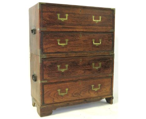 A 19th Century hardwood military/campaign chest Of small proportion,  formed as two sections each with two long drawers, fitt