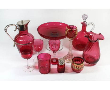 A collection of 19th Century cranberry glassComprising a jug with silver-plated mounts, decanter with looped handle, a tazza,