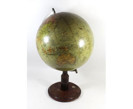 An early 20th Century terrestrial table globeRaised on wooden plinth base with inset compass, height 54cmCONDITION REPORTGene