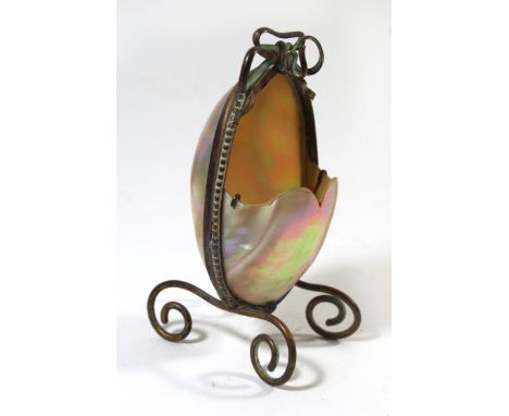 A Victorian copper frame mother of pearl watch standOf ovoid form with scrolling legs, height 11.5cm 