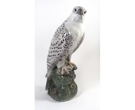 A Royal Copenhagen model of a GyrfalconSet on a rocky plinth base, model no. 1661, height 39cm.CONDITION REPORTBottom of tail