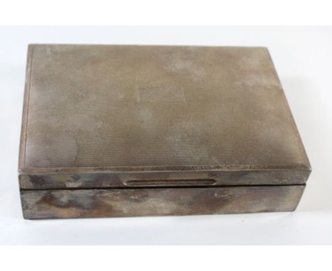 An Elizabeth II silver cigar boxOf rectangular outline with engine turned decoration and hinged lid, Sheffield, 1962, width 1