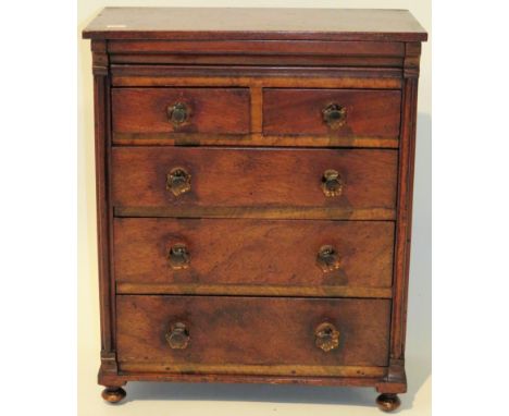 A Victorian apprentice Scotch chestWith two short over three long drawers, pillared side supports and glass handles, height 4