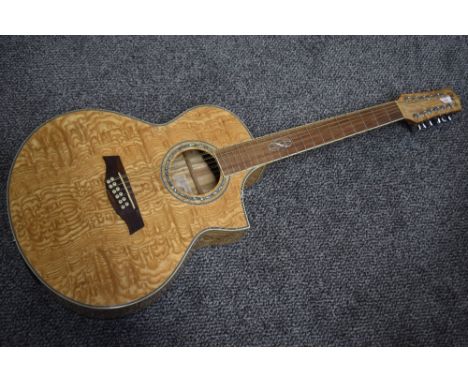 An Ibanez 12 string electro acoustic guitar, in quilted maple, model EW2012 ASENT, no case