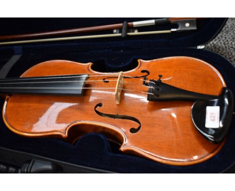 A traditional violin having 14inch two piece bag with figure head to scroll with bow and modern case