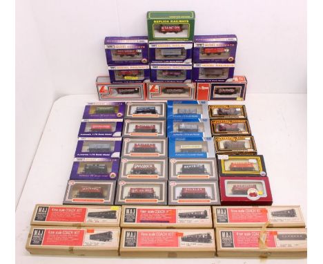 OO Gauge: A collection of assorted boxed OO Gauge, rolling stock and coaches to comprise: Dapol, Mainline, Lima, Maj Trains a