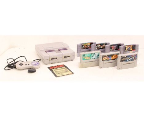 Nintendo: A Super Nintendo Entertainment System, unboxed console, together with one controller, and seven unboxed game cartri