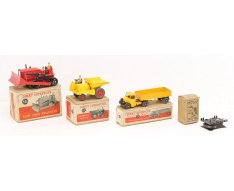 Dinky: A collection of three boxed Dinky Supertoys vehicles to comprise: Dumper Truck, 562; Blaw Knox Bulldozer, 561; and Bed