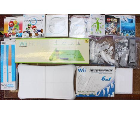 Nintendo: A collection of assorted Nintendo Wii items to include: console, boxed games, Wii Fit, Wii Sports, Mario Kart Wheel