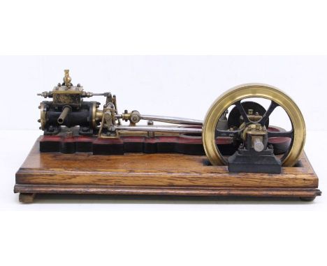 Live Steam: A scratch built, single cylinder, horizontal live steam engine, six-spoke flywheel, upon wooden base, measuring a
