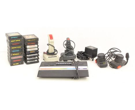 Atari: An unboxed Atari 2600 console with power lead and joystick controllers, together with a collection of unboxed Atari ga