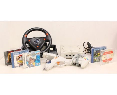 Sega: An unboxed Sega Dreamcast console, PAL-E, together with a Dreamcast controller, steering wheel and gun controller, and 