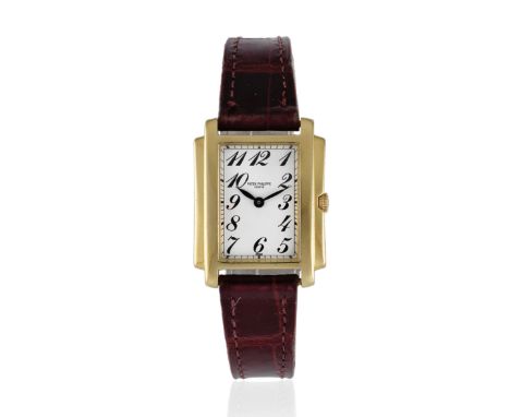 Patek Philippe. A lady's 18K gold quartz rectangular wristwatchModel: GondoloReference: 4824Date: Purchased 10th November 200