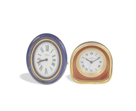 Cartier. A lot of two gilt brass desk clocksThe first with amber coloured lacquer, Roman numeral dial set within an arch fram