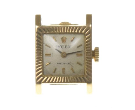 Rolex: A vintage ladies 18k gold manual wind wrist watch
The signed square silvered dial, with hourly applied gold tone baton