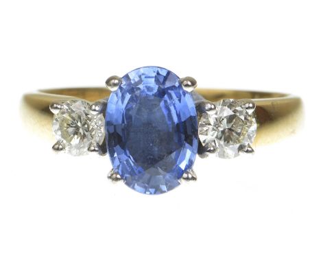 A sapphire and diamond three stone ring
Centering an oval mixed-cut sapphire flanked by two round brilliant-cut diamonds, to 